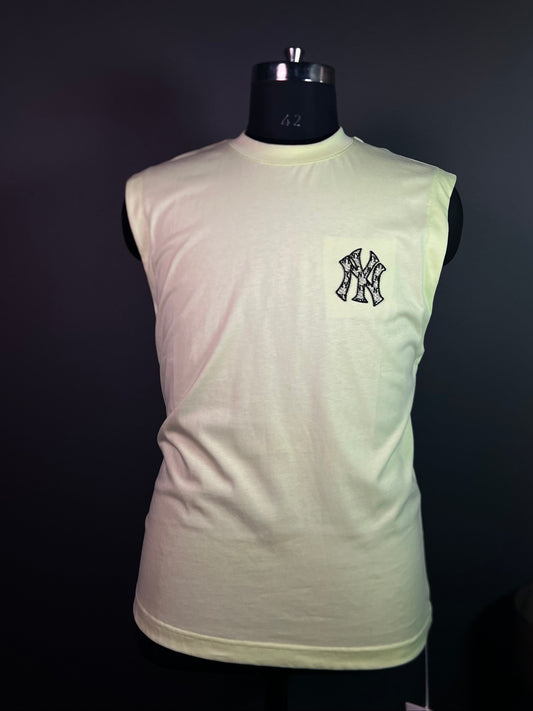 Light green t-shirt with a black logo on a dark background